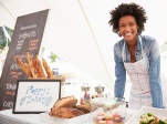 Female Bakery Stall Holder At Farmers Fresh Food Market
